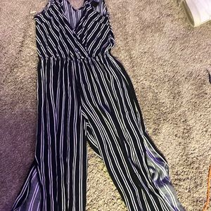 This really cute romper is black with white tripes